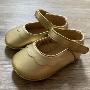 Gold baby shoes